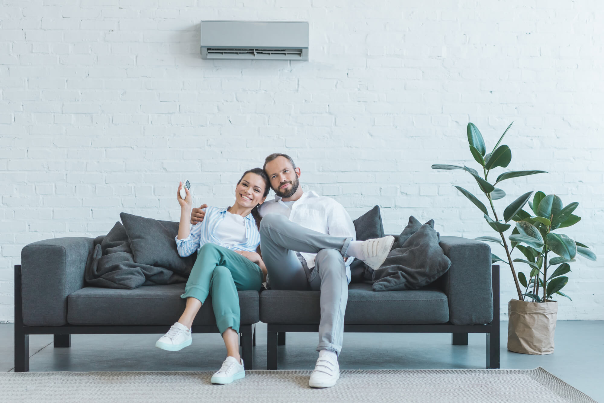 a couple happy with their Air Conditioning in Seattle
