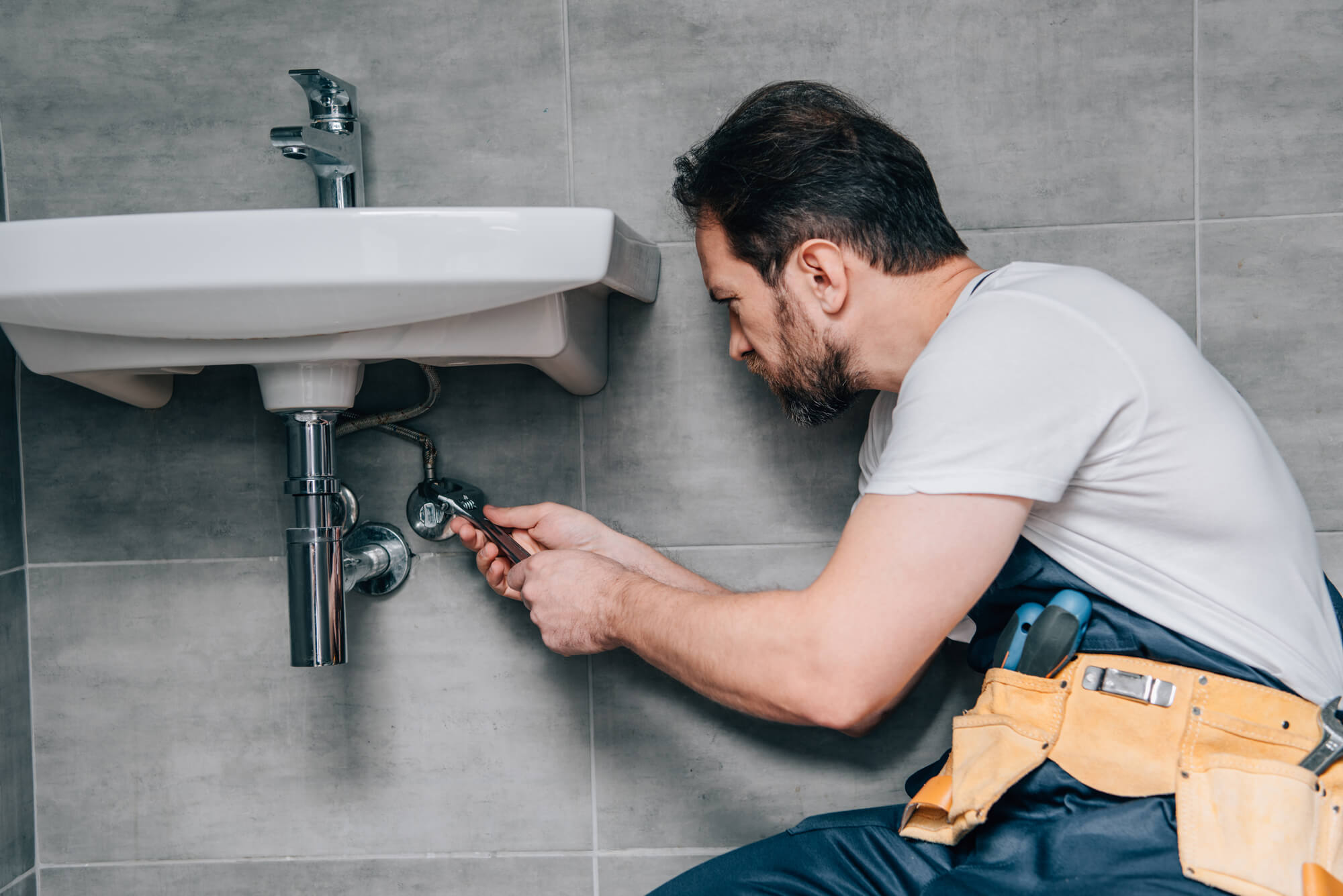 a-Plumber-in-Seattle-fixing-a-sink