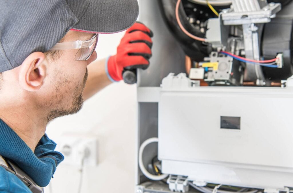 Man looking at furnace before Furnace Repair in Seattle