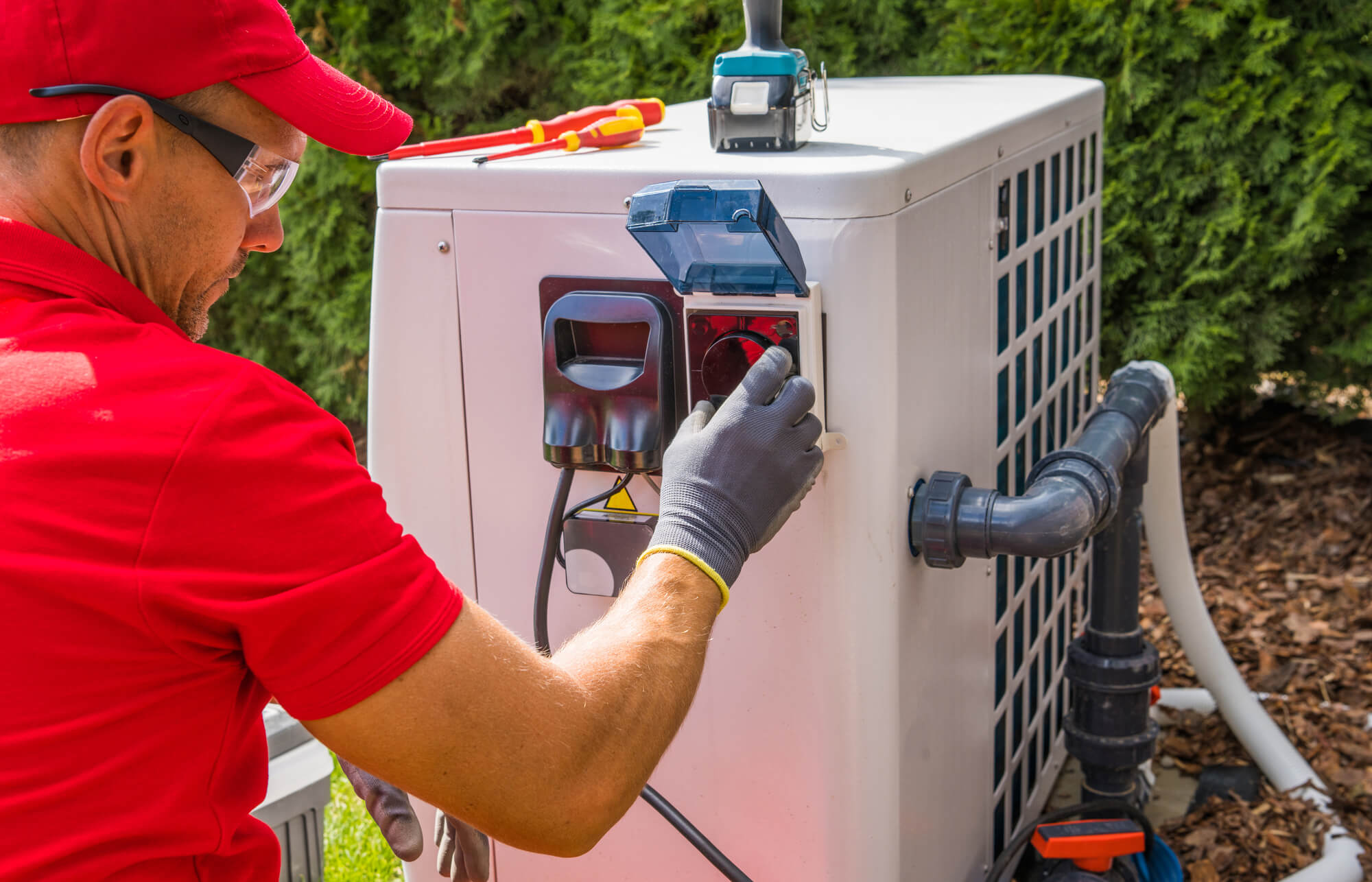 Technician checking a Heat Pump in Seattle