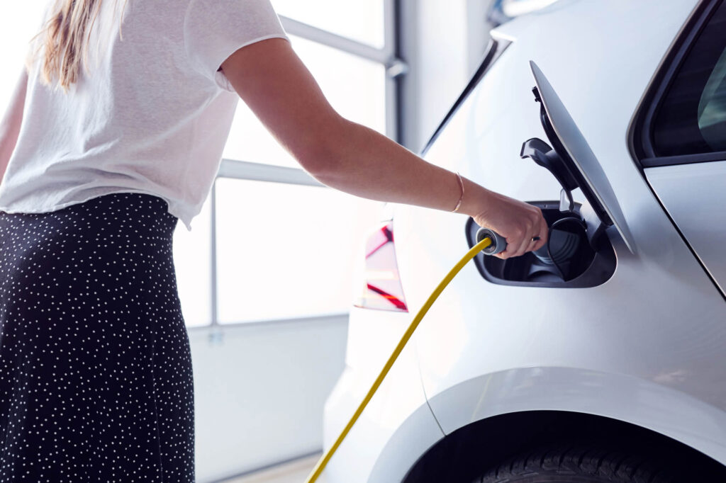 woman using EV Charging in Seattle